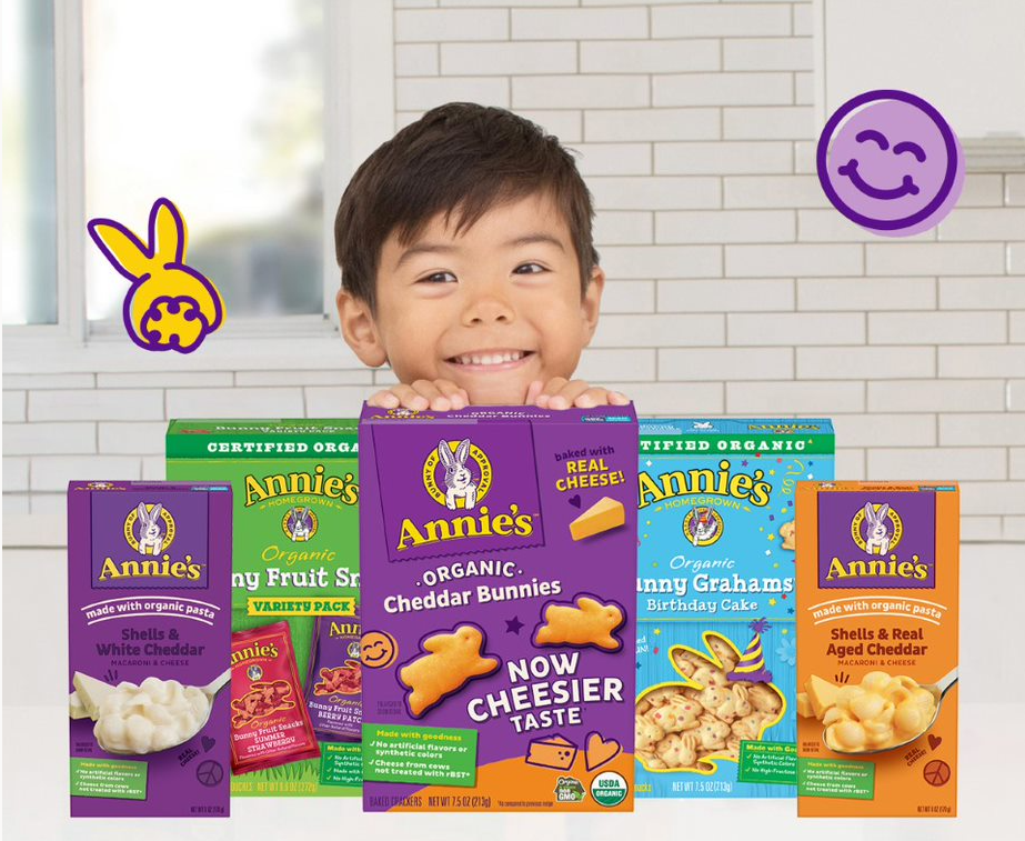 Boy standing behind a box of Annies cheddar bunnies
