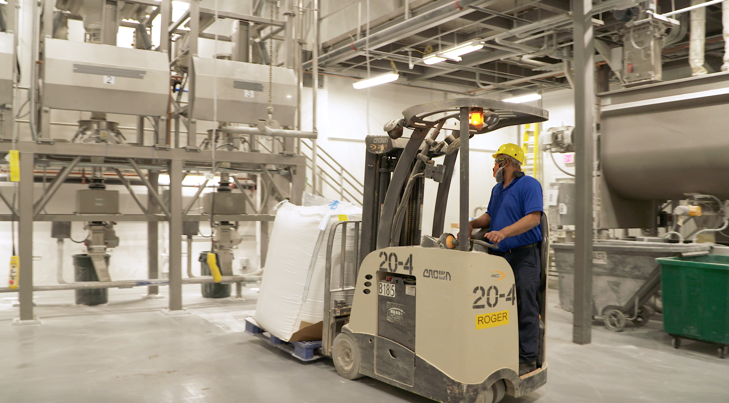 Covington Employee operating a forklift from the side